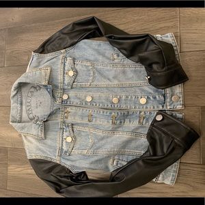 Women’s jean jacket with leather sleeves